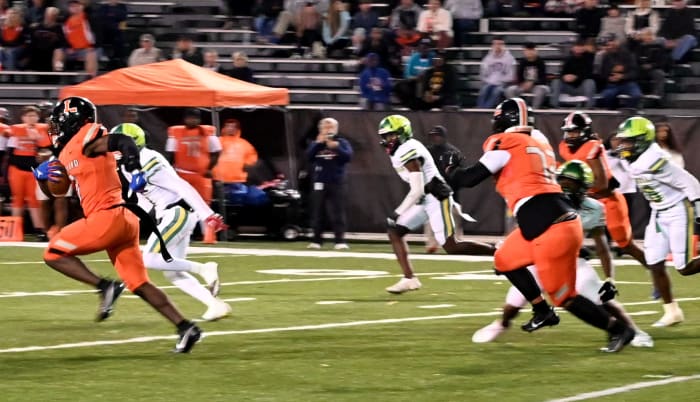 Lakeland running back D'marius Rucker breaks loose on a run against Lake Minneola on Friday during a Class 4S, Region 3 final at Bryant Stadium. He rushed for 351 yards.